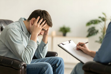 Man Experiencing Distress In Therapy Session