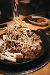A serving of braised blood sausage with rich sauce flavor