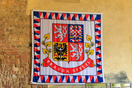 Heraldic coats of arms on the flag of the President, Czech lion, Moravian and Silesian eagle. Prague Castle.