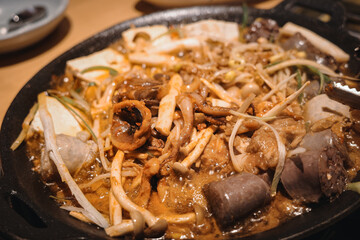 A serving of braised blood sausage with rich sauce flavor