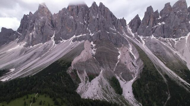 DRONE AERIAL FOOTAGE - The Odle Group is an impressive mountain range in the Dolomites, Bolzano, Trentino Alto Adige, Italy. The main peak of this massif is Mt. Sass Rigais.