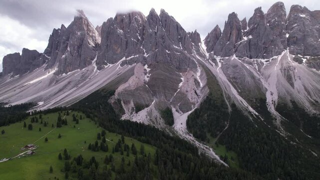 DRONE AERIAL FOOTAGE - The Odle Group is an impressive mountain range in the Dolomites, Bolzano, Trentino Alto Adige, Italy. The main peak of this massif is Mt. Sass Rigais.