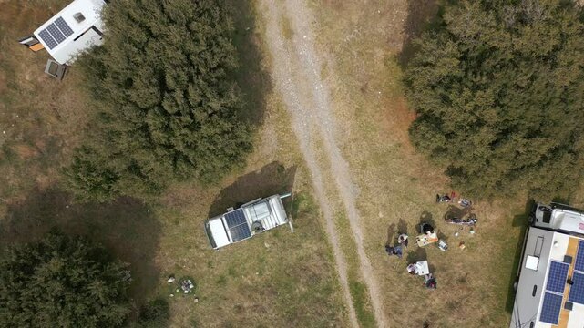 Camper vans parked on a wild spot in Lake Polyfyto drone aerial top view in Greece