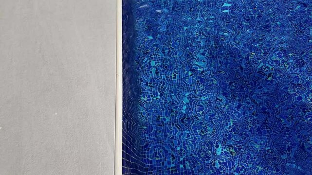 Pool water texture, featuring a bright light blue pattern, evoking freshness and relaxation.