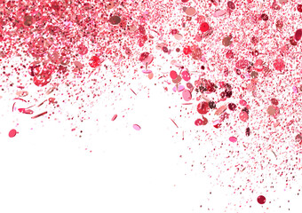 Pink glitter falling on a black background