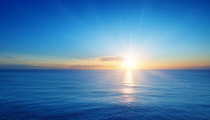 sunrise on the center of clean blue sky ocean