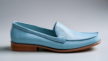 mild blue leather-based loafers slip on footwear isolated on grey background