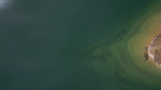 Camper vans parked on a wild spot in Lake Polyfyto drone aerial top view in Greece