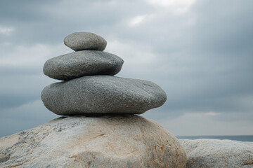       There is a pile of rocks sitting on top of a pile of rocks