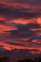 Cloudy orange sunset in the desert mountains