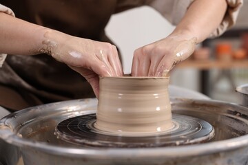 Hobby and craft. Woman making pottery indoors, closeup