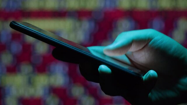 Phone smartphone at night office, Man work with chatbot AI online, connecting with AI and using a chat bot. IT engineer software developer programmer interact with chat bot, making writing code