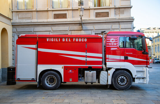 Fire truck parked in city center, emergency vehicle ready for action in urban environment.