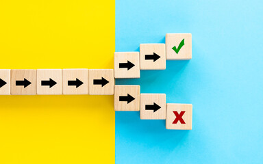 Right or wrong choice. Arrow symbols on wooden dice splitting in different directions, Symbol of...