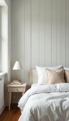 White walls, wood paneling, bed, pillows, bedside lamp, books , natural, bedroom decor