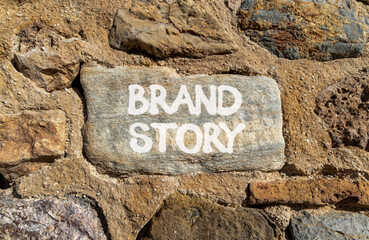 Brand story branding symbol. Concept words Brand story on beautiful grey stone. Beautiful big stone wall background. Business brand story branding concept. Copy space.