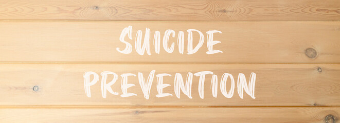 Suicide prevention symbol. Concept words Suicide prevention on beautiful wooden wall. Beautiful wooden wall background. Psychological and suicide prevention concept. Copy space.