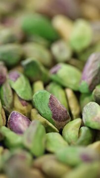 Pistachio nuts shifting focus closeup shot vertical