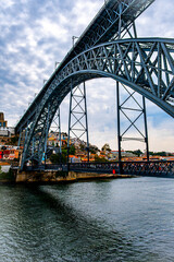 Fototapeta premium Stunning bridge with a close-up background of the city of Porto