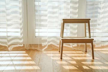 Minimalist wooden stool in sunlit interior