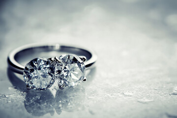       Two rings with a pink diamond and a white diamond