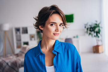 Portrait of positive stunning young lady good mood enjoy free time morning spacious bright house inside