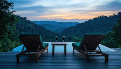 Obraz premium A pair of lounge chairs are set up on a deck overlooking a pool and mountains