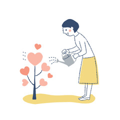 ハートの木に水をやる女性