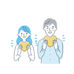 ハートを持っている笑顔の若いカップル
