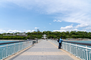 scenic bridge view leading into green cityscape