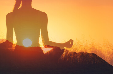 Physical wellbeing and mental health, Woman in yoga pose, zen, calming, quiet meditation at sunset....