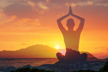 Physical wellbeing and mental health, Woman in yoga pose, zen, calming, quiet meditation at sunset....