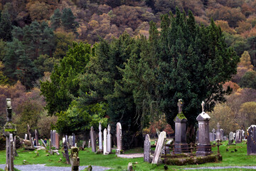 Naklejka premium Medieval cemetery of the Glendalough monastery in the Wicklow mountains in IrelandMedieval cemetery of the Glendalough monastery in the Wicklow mountains in Ireland