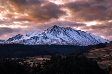 beautiful snowy landscape of Snow-Capped Volcano Nevado de Toluca ( Xinantecatl ) at Sunrise in Toluca state in Mexico.	
