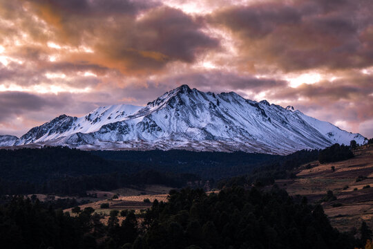 beautiful snowy landscape of Snow-Capped Volcano Nevado de Toluca ( Xinantecatl ) at Sunrise in Toluca state in Mexico.	