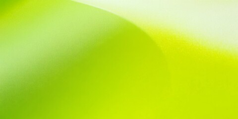 A lime green colored metallic paper surface texture. Smooth abstract background of vibrant green to emerald color.