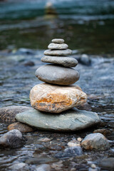 stack of stones balanced at river for meditation