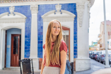 Female tourist in front of Casa de los Azulejos in Villahermosa, Mexico. Quintana Roo travel, cultural exploration, and historic architecture concept