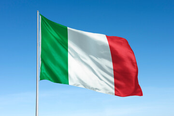Waving Italy flag, national symbol, blue sky