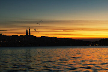 Fototapeta premium Cityscape during sunset at the harbor in the capital of Sweden - Stockholm