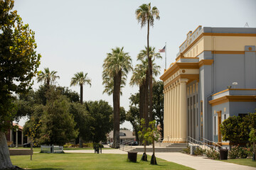 Afternoon sun shines on historic buildings of downtown Hanford, California, USA.