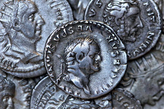 Roman silver denarius coin showing portrait of emperor Flavius Vespasianus