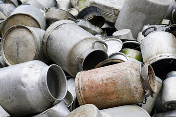 Large pile of various old aluminum pots and cans, aluminum scrap background