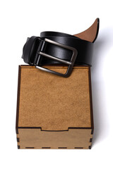 black leather men's belt gift wooden box isolated on white background, for design and advertising