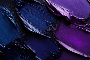A close-up of textured purple and blue paint strokes on a canvas background.