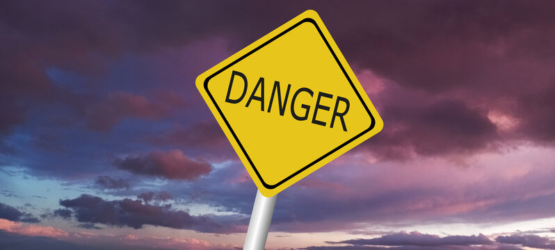 danger,caution,Hurricane Idalia warning sign against a powerful stormy background with copy space. Dirty and angled sign with cyclonic winds add to the drama.hurricane season sign on cloudy background