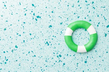 Life preserver on colorful background summer pool scene photography bright aesthetic top view safety concept
