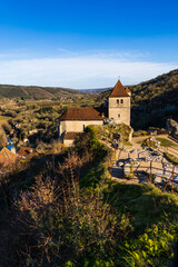 Obraz premium Saint-Cirq-et-Sainte-Juliette Church overlooking the Lot Valley in the medieval village of Saint-Cirq-Lapopie