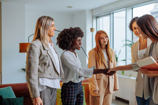 Businesswomen meeting an intern in the lounge