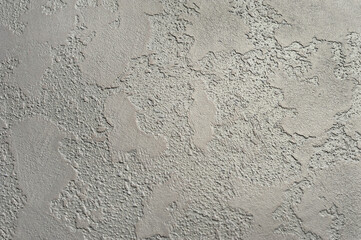 Textured Venetian decorative plaster. Wall, relief texture with deep grooves. effect of natural worn concrete wall.